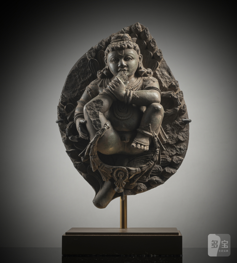 A STONE FIGURE OF KRISHNA
